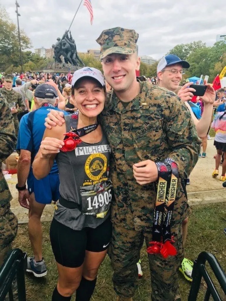 Marine Corps Marathon finisher with a Marine