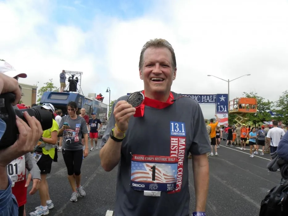 Drew Carey with a finisher medal